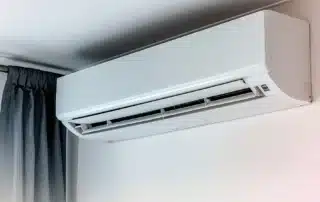 Modern ductless mini-split cooling system installed inside a home providing energy-efficient temperature control
