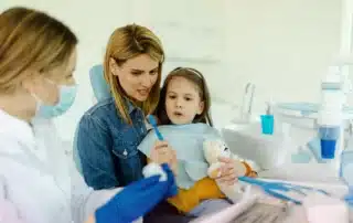 Smiling family with healthy teeth together outside