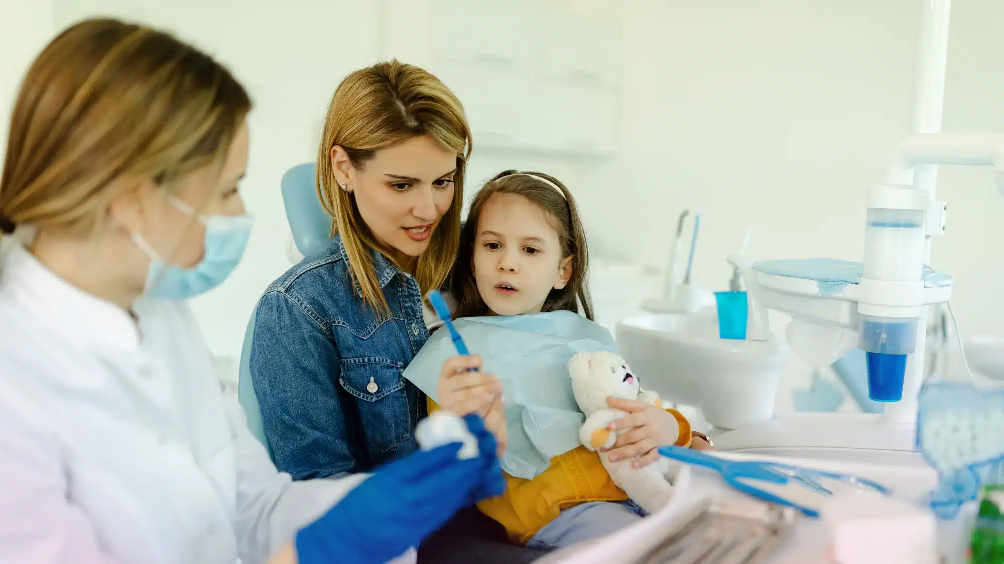 Smiling family with healthy teeth together outside