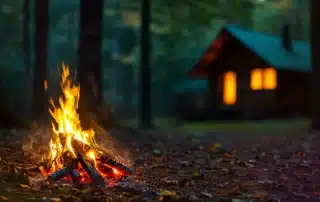 Family camping at a year-round campground in Bozrah Connecticut surrounded by wooded nature and RV and tent sites