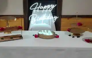 A cheerfully decorated, affordable birthday party hall in Bristol, bustling with happy guests and children enjoying the celebration.