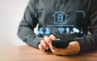 A person interacting with a smart home security system via a tablet, showcasing convenience and control.