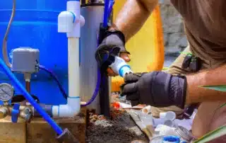 Water pump contractor in Union CT inspecting and repairing a residential well water system for reliable water supply