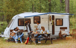 A scenic view of an RV camping site in Bozrah CT surrounded by lush greenery.
