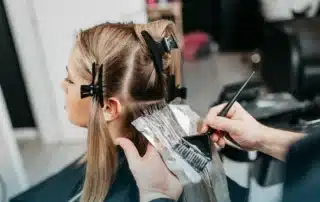 Woman with beautifully styled balayage in East Lyme CT salon