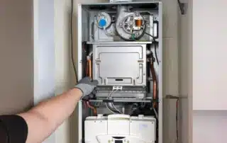 Technician troubleshooting a heating system in Canterbury, CT home