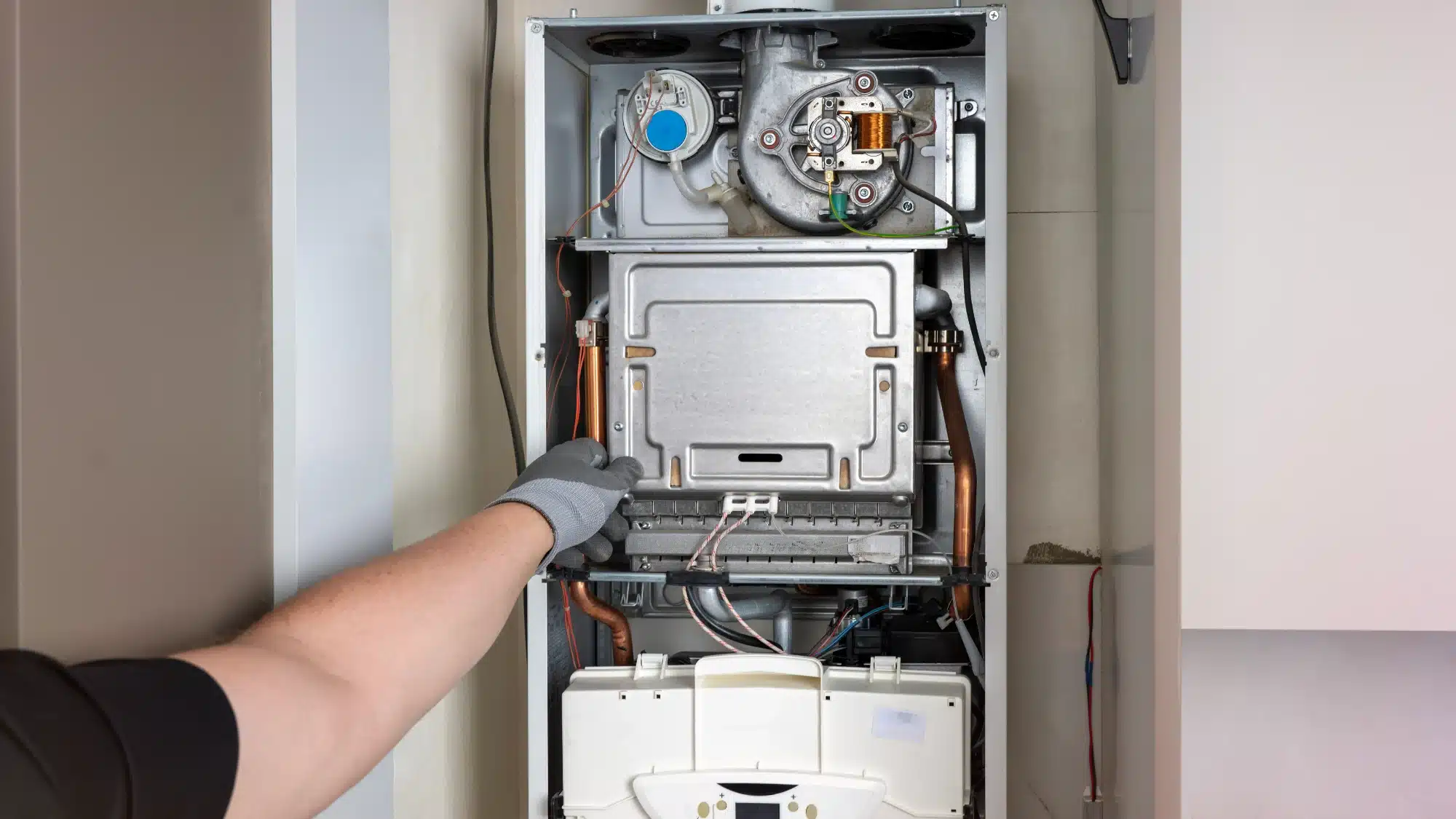 Technician troubleshooting a heating system in Canterbury, CT home