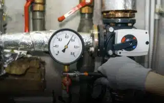 A technician performing well pump repair in Stafford CT home.