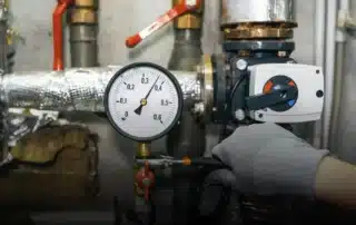 A technician performing well pump repair in Stafford CT home.