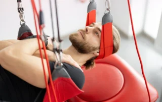 Patient enjoying Redcord Therapy Santa Monica exercise for improved posture