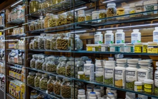 Image of cannabis flower, pre-rolls, and vapes displayed in an Antioch CA weed shop near me.