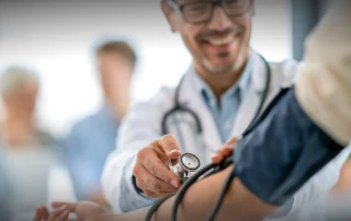 A chronic care specialist consulting with a patient in a Duluth clinic