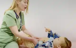 Baby in doctor's office for GI consultation due to reflux and feeding difficulties.